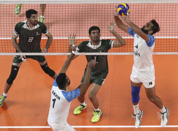 Rajit Singh of India, foreground, plays against Pakistan during their men volleyball match at the 18th Asian Games in Jakarta, Indonesia onTuesday.