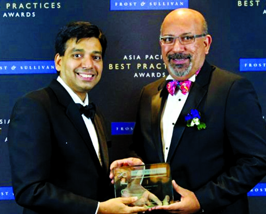 Suresh Sidhu, CEO of edotco Group, receiving the "Asia Pacific Telecoms Tower Company of the Year" Award from Ajay Sunder, Vice-President of Frost & Sullivan at the Shangri-La Hotel, Singapore on Monday. The awards recognize best-in-class companies that