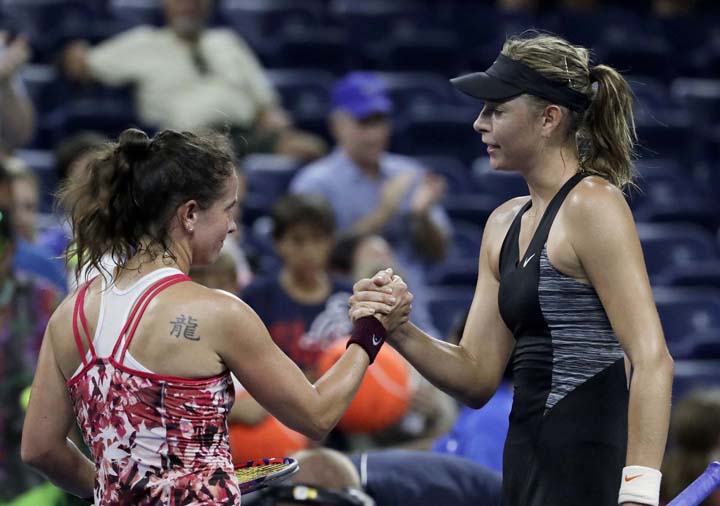 Patty Schnyder (left) of Switzerland, and Maria Sharapova of Russia, shake hands after Sharapova won their first round match at the US Open tennis tournament on Tuesday.