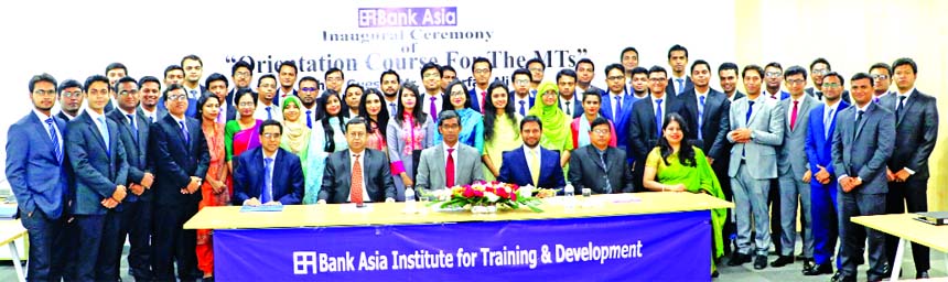 Md. Arfan Ali, Managing Director of Bank Asia Limited, poses for photo session with the participants of the orientation course for Management Trainees at the Bank's Institute for Training & Development in the city on Thursday. Mohammad Ziaul Hasan Molla,