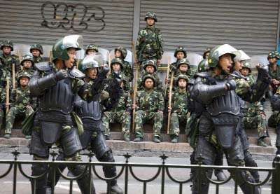 Chinese paramilitary police practice during a break from patrol in Urumqi, western China's Xinjiang province.