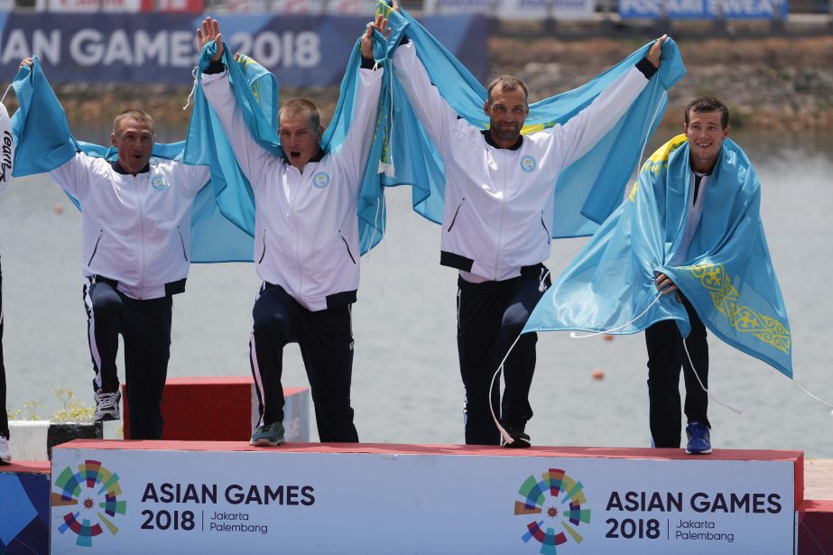 Team Kazakhstan celebrate during awards ceremony for the final for men's kayak four 500m at the 18th Asian Games in Palembang, Indonesia on Thursday.