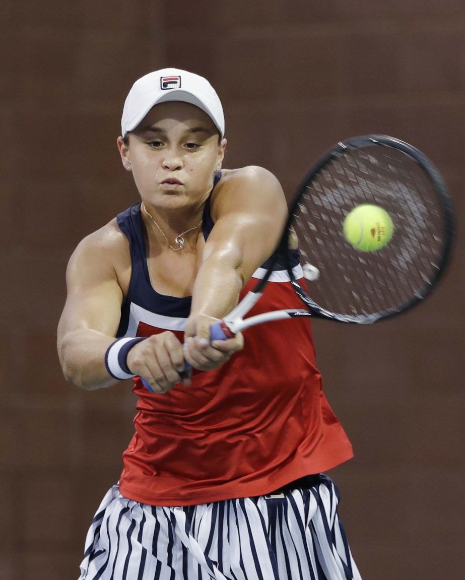Ashleigh Barty of Australia, hits a backhand to Lucie Safarova of the Czech Republic, during the second round of the US Open tennis tournament on Wednesday.