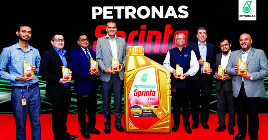 Mohd. Khalid Bin Mohamed Latiff, regional head of PETRONAS Lubricants International (PLI) Asia Pacific, poses for a photo session after inaugurates the consumer promotion for its Sprinta premium motorcycle oil at its sole distributor in Bangladesh by Unit