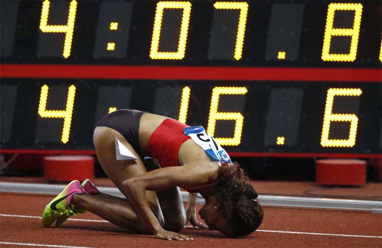 Bahrain's Kalikidan Befkadu rests on the track after winning the women's 1500m final during the athletics competition at the 18th Asian Games in Jakarta, Indonesia on Thursday.