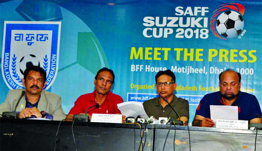Senior Vice-President of Bangladesh Football Federation (BFF) Abdus Salam Murshedy reading the papers of the SAFF Suzuki Cup during a press conference at the conference room in BFF House on Friday.