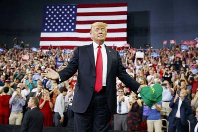 President Trump arrives to speak at a campaign rally at Ford Center in Evansville, Ind. on Thursday.