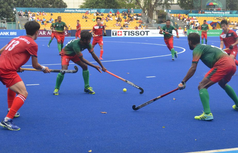 An action from the place-deciding match of the Hockey Competition of the 18th Asian Games between Bangladesh and South Korea at Jakarta in Indonesia on Saturday. Moin Ahamed