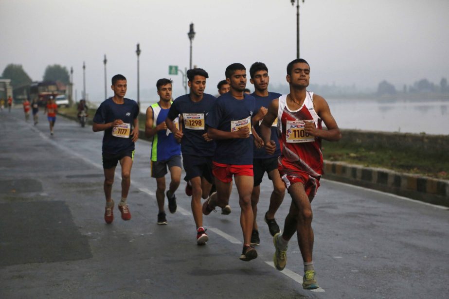 Kashmiri participants run during "Run for Peace", a marathon event in Srinagar, Indian controlled Kashmir on Sunday.