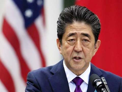 Japan's Prime Minister Shinzo Abe attends a memorial service ceremony marking the the 73rd anniversary of Japan's surrender in World War Two, at Budokan Hall in Tokyo.