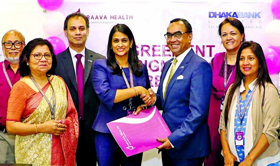 Syed Mahbubur Rahman, Managing Director of Dhaka Bank Limited and Sylvana Q. Sinha, founder and Managing Director of Praava Health, exchanging a MoU signing documents at the company office in the city recently. Under the deal, all employees and Credit and