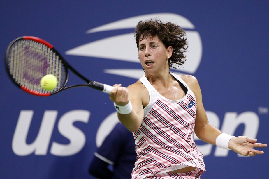 Carla Suarez Navarro of Spain, returns a shot to Maria Sharapova of Russia, during the fourth round of the US Open tennis tournament in New York on Monday.