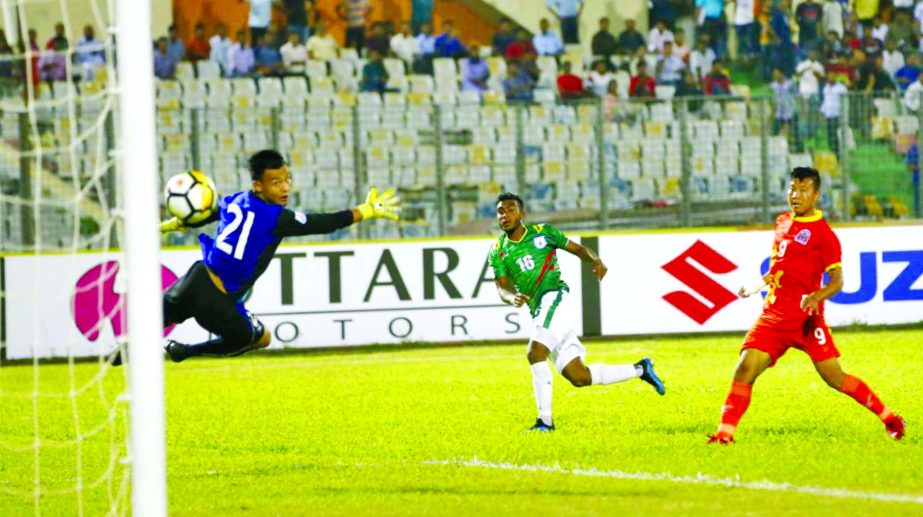 Mahbubur Rahman Sufil scoring a goal against Bhutan in a match of the SAFF Suzuki Cup Championship at the Bangabandhu National Stadium on Tuesday.