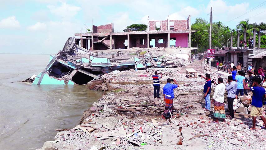 SHARIATPUR: About two hundred years old Munafganj Bazar has been facing extinction as Padma River erosion has taken a serious turn. This picture was taken yesterday.