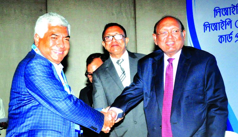 Md Jasim Uddin, Vice- Chairman of Bengal Group, receiving the CIP card for his outstanding contribution in export sector from Tofail Ahmed, Commerce Minister at a hotel in the city on Monday.