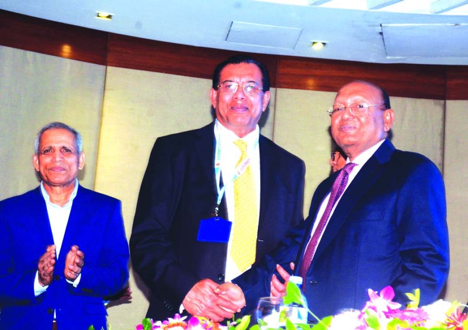 S M Amzad Hossain, Chairman South Bangla Agriculture and Commerce (SBAC) Bank Ltd, receiving CIP (commercially important person) card from Commerce Minister Tofail Ahmed as ex-officio member of FBCCI in the trade category for 2015. Ministry of Commerce an