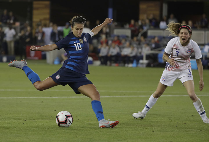 United States' Carli Lloyd (10) kicks the ball past Chile's Carla Guerrero to score a goal during the second half of an international friendly soccer match in San Jose, Calif. on Tuesday.