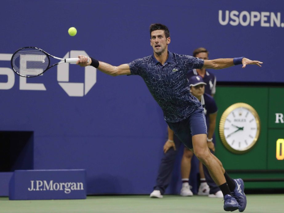 Novak Djokovic of Serbia, returns a shot to John Millman of Australia, during the quarterfinals of the US Open tennis tournament in New York on Wednesday.