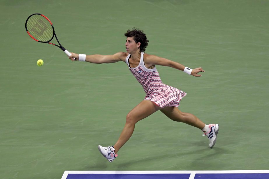 Carla Suarez Navarro of Spain, returns a shot to Madison Keys during the quarterfinals of the U.S. Open tennis tournament in New York on Wednesday.