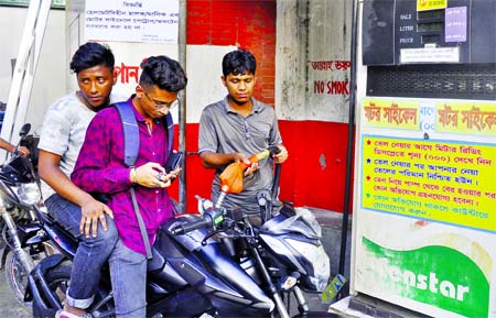 A motorcycle rider taking fuel from a petrol pump without using helmet though DMP's directive was issued not to give fuel to any motorcyclist without helmet. The snap was taken from Matsya Bhaban area in the city on Thursday.