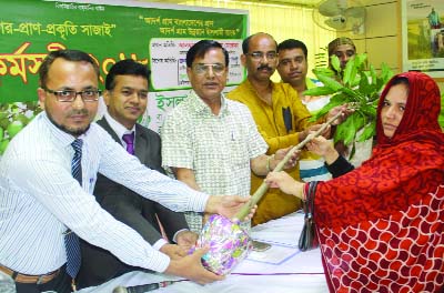 BHALUKA(Mymensingh): Gulam Mustafa, Chairman, Bhaluka Upazila Parishad distributing saplings among the villagers organised by Islami Bank Bangladesh Ltd, Bhaluka Branch yesterday. Among others, Rafiqual Islam Pinto, Vice- Chairman, Bhaluka Upazila Pa