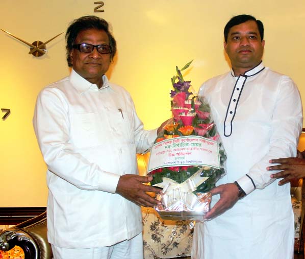 Prof Dr MA Mannan. Vice Chancellor of Bangladesh Open University presenting flower bouquet to Adv. Md Jahangir Alam, newly elected Mayor of Gazipur City Corporation at his residence in Gazipur on Tuesday.