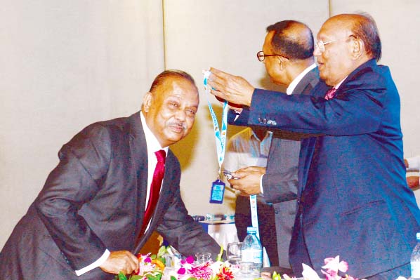 Commerce Minister Tofael Ahmed in a recent event in the city giving CIP card to Md. Azizul Islam, Chairman of Alif Group and former Chairman, Board of Trustees, Eastern University for his outstanding performance and contribution in the export sector.