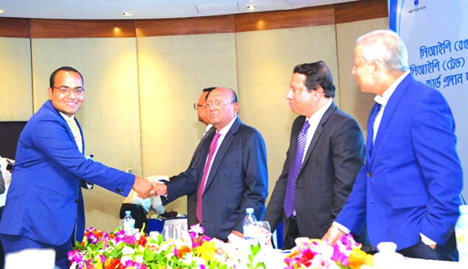 Shakhawat Hossain, Managing Director of Paramount Textile Limited, receiving the CIP card of 2015 for his substantial contribution to the national exports of the country from Commerce Minister Tofail Ahmed at a hotel in the city recently.