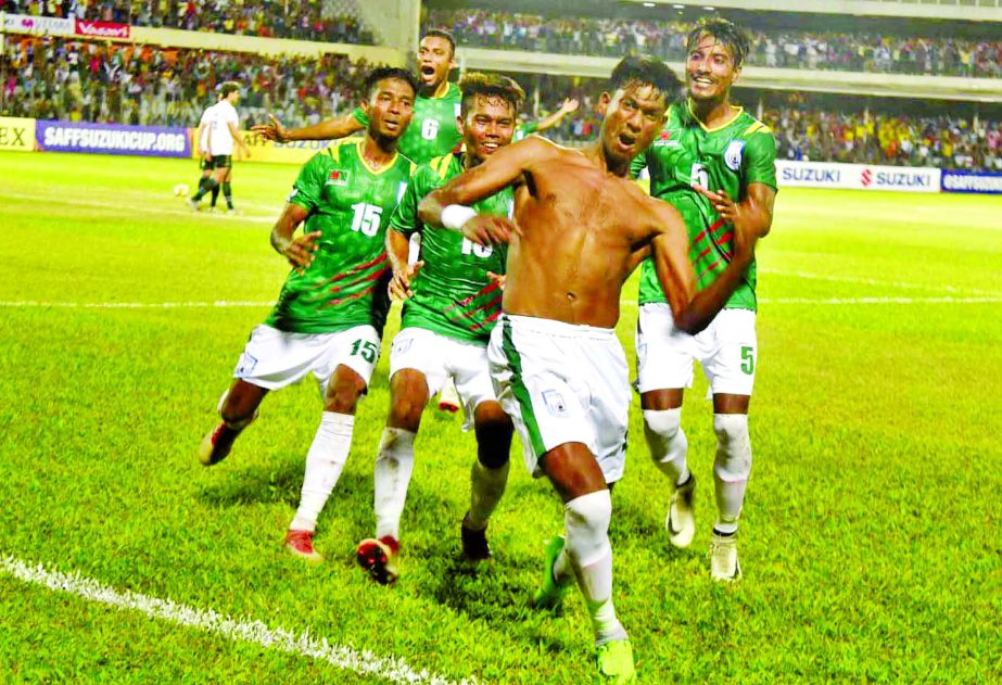 Players of Bangladesh celebrating after scoring a goal against Pakistan in their second Group-A match of the SAFF Suzuki Championship at the flood-lit Bangabandhu National Stadium on Thursday.