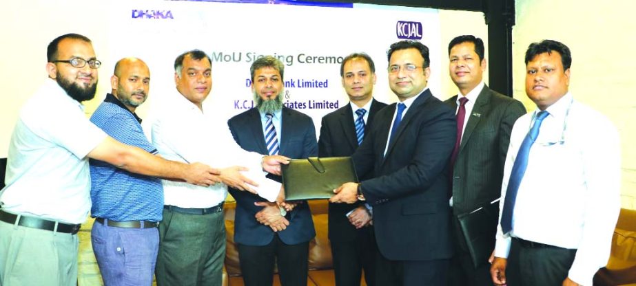 HM Mostafizur Rahaman, SVP (Retail Business Division) of Dhaka Bank Limited and Kazi Hassan Zaki, Managing Director of KCJ & Associates Limited, exchanging a MoU signing documents for joint Marketing of Car Loan at KCJ's head office in the city recently.