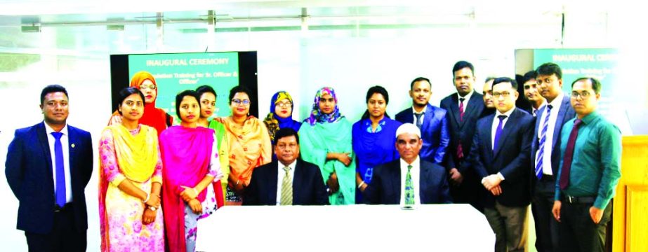 Md. Abdul Halim Chowdhury, Managing Director of Pubali Bank Limited, poses for a photo session with the participants of a training course on 'Foundation Training for Senior Officers at the Bank's Training Institute in the city recently. Niranjan Chandra