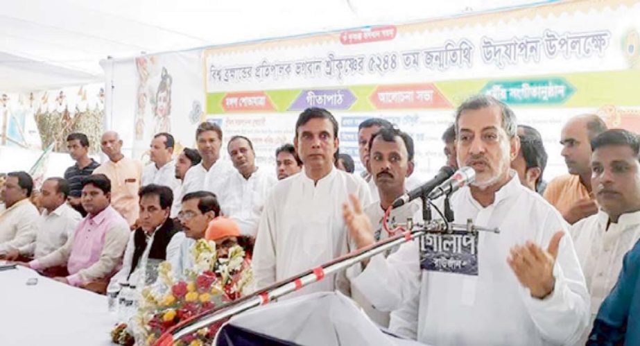 Chairman of the Parliamentary Standing Committee on Ministry of Railway, ABM Fazle Karim Chowdhury MP addressing the pre-rally function of Janmastami celebration at Upazila Parishad square in Raozan on Sunday.