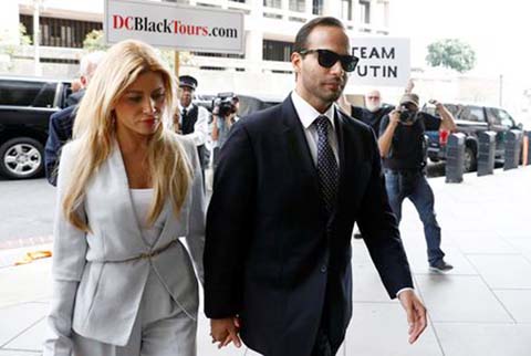 Former Trump campaign aide George Papadopoulos with his wife Simona Mangiante arrives for his sentencing hearing at U.S. District Court in Washington on Friday.