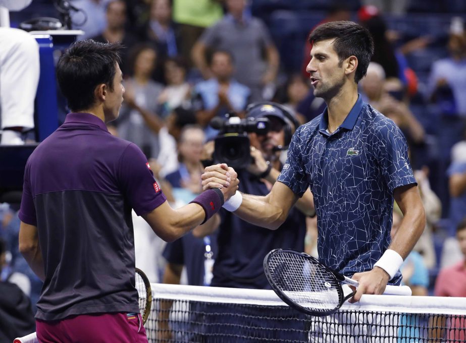 Novak Djokovic of Serbia, shakes hands with Kei Nishikori of Japan, after Djokovic defeated Nishikori during the semifinals of the US Open tennis tournament in New York on Friday.