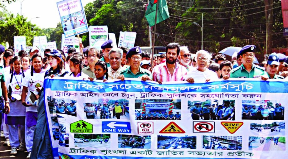 Traffic department of the Dhaka Metropolitan Police brought out a rally on Saturday to create awareness among the people about the traffic discipline. This photo was taken from Shahbag area.