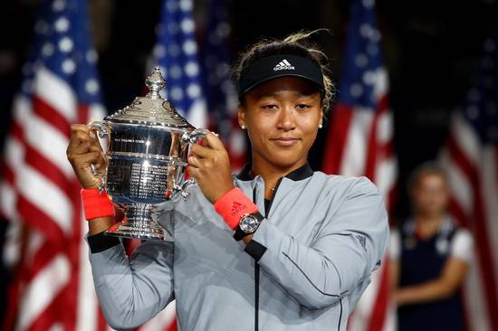 Naomi Osaka, of Japan, holds the trophy after defeating Serena Williams in the women's final of the US Open tennis tournament on Saturday.