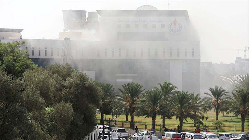 Smoke shrouded the headquarters of the National Oil Corporation (NOC) in Tripoli