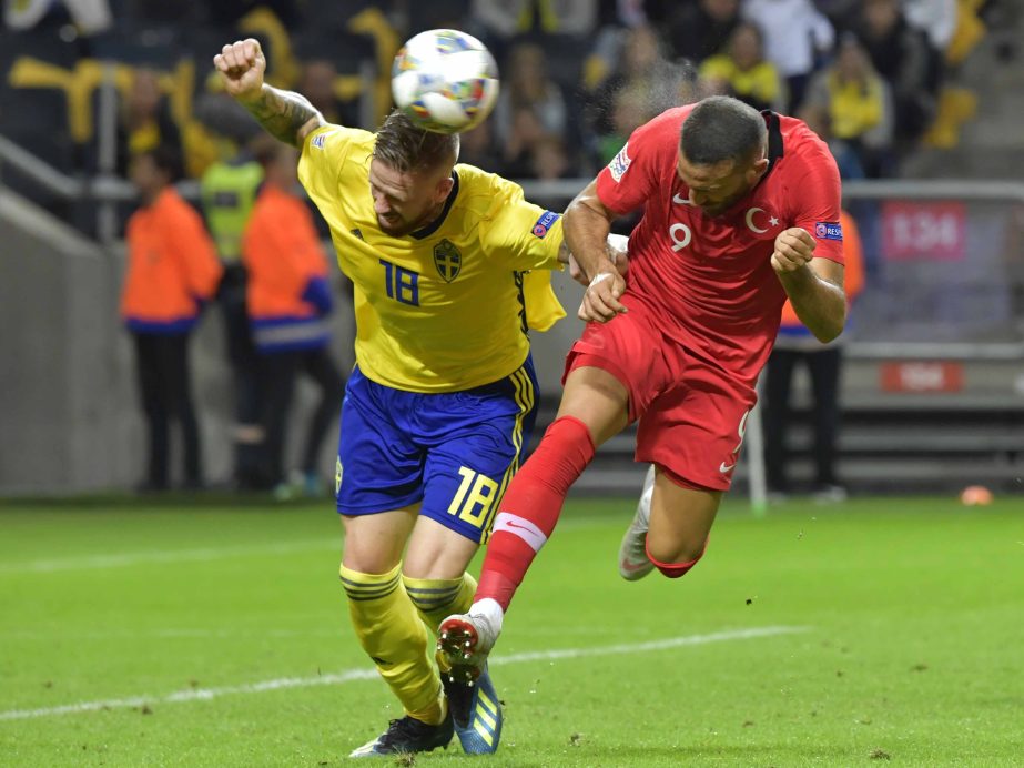 Sweden's Pontus Jansson (left) fights for the ball with Turkey's Cenk Tosun during the UEFA Nations League soccer match between Sweden and Turkey at Friends Arena in Solna, Stockholm on Monday.