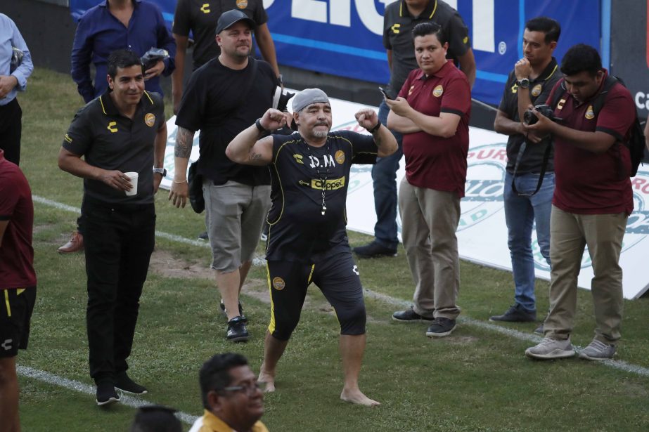 Former soccer great Diego Maradona says goodbye to the fans in stands, after a training session at the Dorados de Sinaloa soccer club stadium, after Maradona was presented as the new manager of the Dorados in Culiacan, Mexico on Monday.