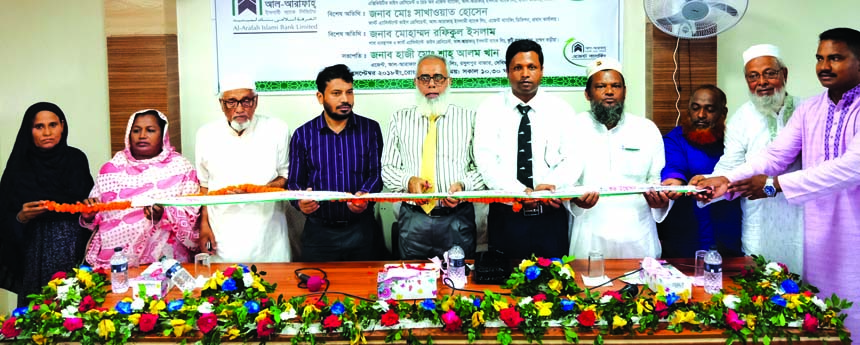 Abed Ahmed Khan, Head of Agent Banking Division of Al-Arafah Islami Bank Limited, inaugurating its 162nd Agent Outlet at Rasulpur Bazar, Debidwar, Cumilla on Monday. Manager of Kutibazar Branch Md. Rafiqul Islam, Manager Companigonj Branch Md. Neyamatul