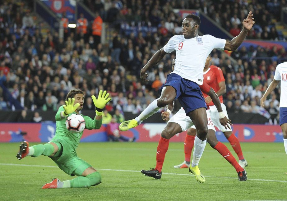 Switzerland goalkeeper Yann Sommer (left) and England's Danny Welbeck challenge for the ball during the International friendly soccer match between England and Switzerland at the King Power Stadium in Leicester, England on Tuesday.