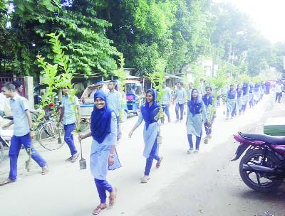 JAMALPUR: Students brought out a rally marking the Tree Fair at Melandah Upazila yesterday.