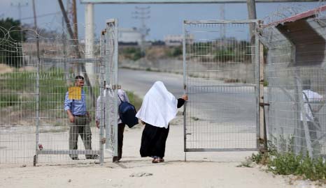 Palestinians pass through the Erez crossing with Israel, near Beit Hanun in the northern Gaza Strip