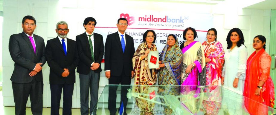 Nilufer Zafarullah, MP, Vice-Chairman of Midland Bank Limited, handing over a CSR cheque of financial assistance for running year-long breakfast programme among the students of Shishu Bikash Kendro (a School operated by ZONTA Club Dhaka III, located at ci