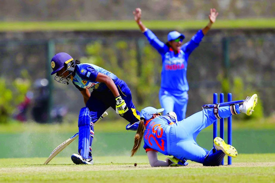 India's Taniya Bhatia successfully takes a run out to dismiss Sri Lanka's Nipuni Hansika during their second women's one day international cricket match in Galle, Sri Lanka on Thursday.