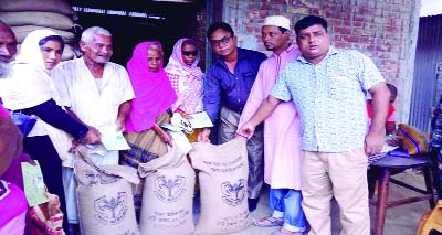 RANGPUR: Chairman of Chandanat Union Md. Amenur Rahman with officials concerned distributing 30 kilogram rice at Tk 10 per kilogram among each of the 1,837 card beneficiaries last week on the union parishad premises under Sadar Upazila under the governmen