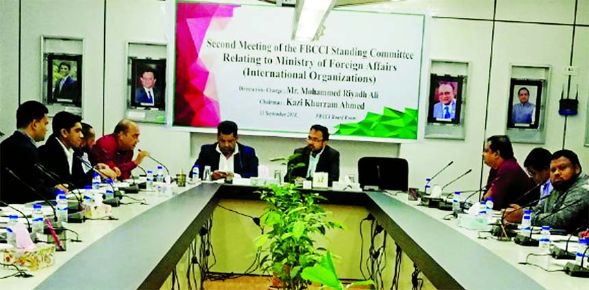 Kazi Khurram Ahmed, Chairman of the Standing Committee of FBCCI, presiding over its meeting relating to Ministry of Foreign Affairs at its Board Room in the city on Thursday. Md. Riyadh Ali, Director and members from different sectors were also present.