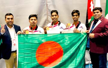 Members of Bangladesh Taekowondo team, which won gold medal in the men's event of Canada Open Taekwondo Championship pose for a photo session in Canada on Friday.