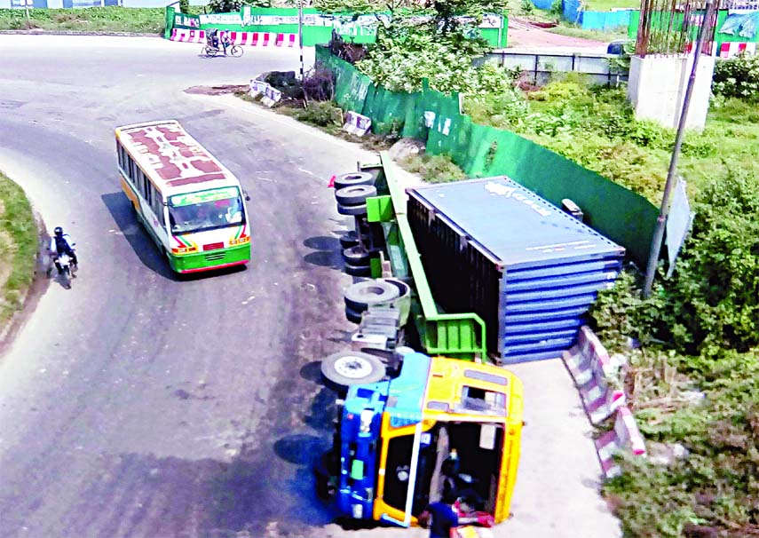 A container overturned at the Kuril Moor near the flyover due to reckless driving. The photo was taken on Saturday.