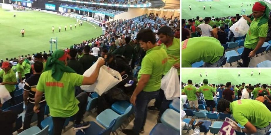 Bangladeshi supporters cleaning the galleries of the Dubai International Cricket Stadium for the spectators who arrived at the galleries to watch the opening match of the Asia Cup between Bangladesh and Sri Lanka on Saturday.